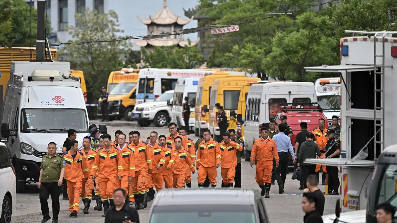 Rescue workers arrive to carry out rescue operations following a gas explosion. Pic/AFP